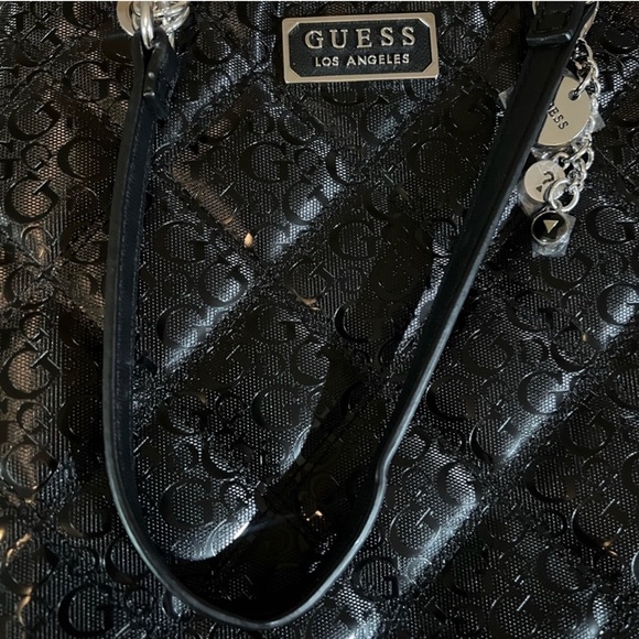 Guess Black shoulder bag. Like new! still has plastic on it and it’s authentic!! - Picture 7 of 8